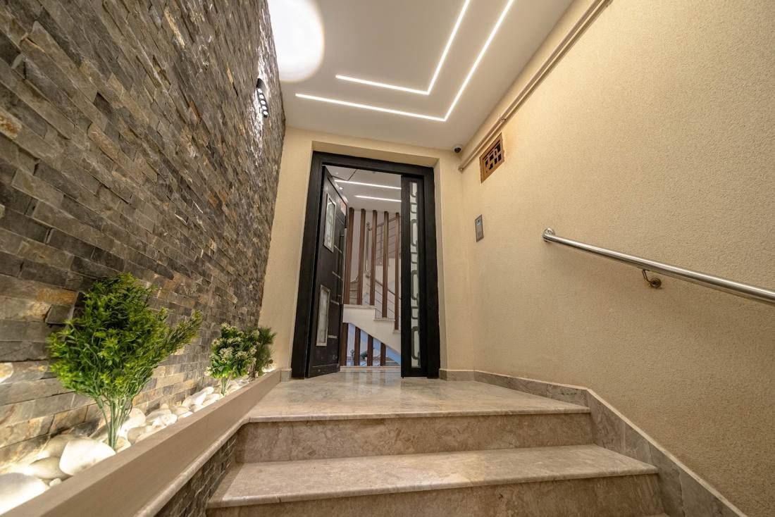 Stone-clad stairway to a residence entrance